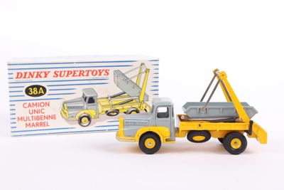 a toy truck with a crane on it next to a boxed box