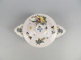 a white bowl with a floral design on it