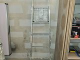 a ladder that is leaning against a wall in a room