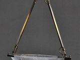 a brass plated hanging light fixture with a glass bowl