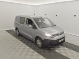 the van is parked in a clean room with a black and white checkered floor