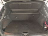 a trunk of a car with the back seats folded down