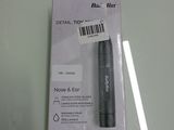 un stylo noir posé sur une boîte