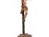a statue of jesus on the cross on a pedestal