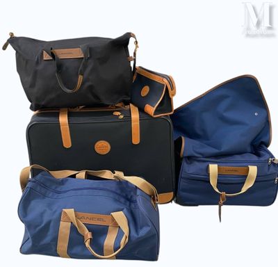 four pieces of luggage sitting on top of each other on a white surface