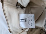 a label on the back of a jacket with a picture of a horse on it