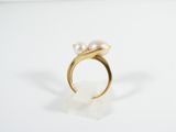 gold ring with pearls on a white background
