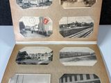an old black and white photo of a train station with pictures on it