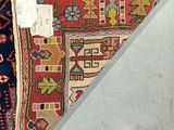 a cat that is laying on a rug on the floor