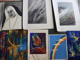 many different pictures of a nun on a table