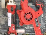a red cordless drill and a red cordless hammer sitting on a tool box