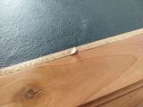 a close up of a wooden table with a glass top