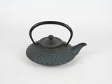 a black teapot with a handle on a white surface