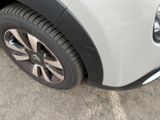 a close up of a car ' s tire on the pavement