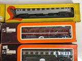 three boxed train cars sitting on top of each other on a table