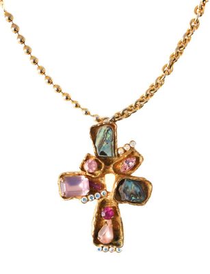 an image of a gold cross with multi colored stones on a chain