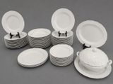 a lot of plates that are sitting on a table