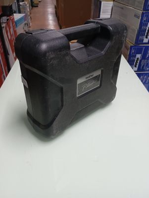 a black tool box sitting on top of a table