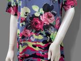 an image of a mannequin wearing a dress with flowers on it