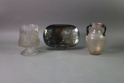 three vases and a tray sitting on a table