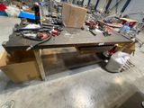 a workbench with tools on it in a warehouse