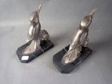 pair of art deco bird bookends on black marble bases