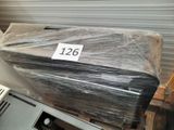 a stack of boxes wrapped in plastic sitting on a shelf