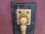 a brass door handle on the door of a house
