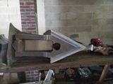a metal object on a wooden table in a room