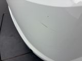 a close up view of a white toilet in a bathroom