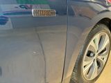 a car with a sticker on the side of it ' s door