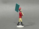 a figurine of a man in a red uniform holding a green sign