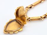 an image of a gold locke with a chain on a white surface