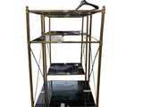 a black and gold shelf with three shelves on top of it