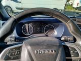 a close up of a steering wheel and dashboard of a car