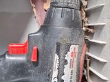 a drill that is sitting on the side of a wall