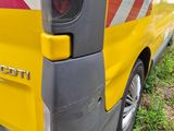 a yellow van with a red and white stripe on the back