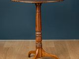 a wooden table sitting on top of a hard wood floor