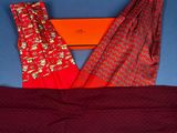 two pairs of red and gold patterned pants and a red scarf on a blue background
