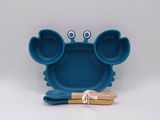 an image of a blue plate with a fork and spoon in it