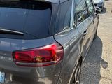 a car that is parked in a lot with other cars