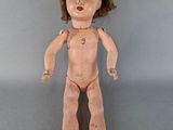 an image of a doll that is standing up on a table