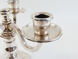 a silver candelab with two cups on it