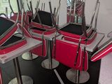 a lot of chairs that are lined up in a room
