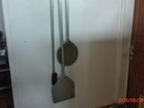 two spats hanging on the wall next to a door