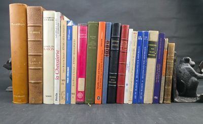 a lot of books that are stacked on top of each other
