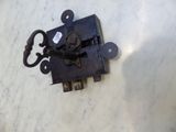 a black latch on the side of a white table