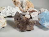 many different types of rocks on a white surface