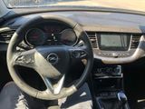 dashboard view of a car with a steering wheel and dashboard controls