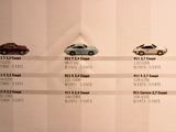 a lot of cars that are on display on the wall